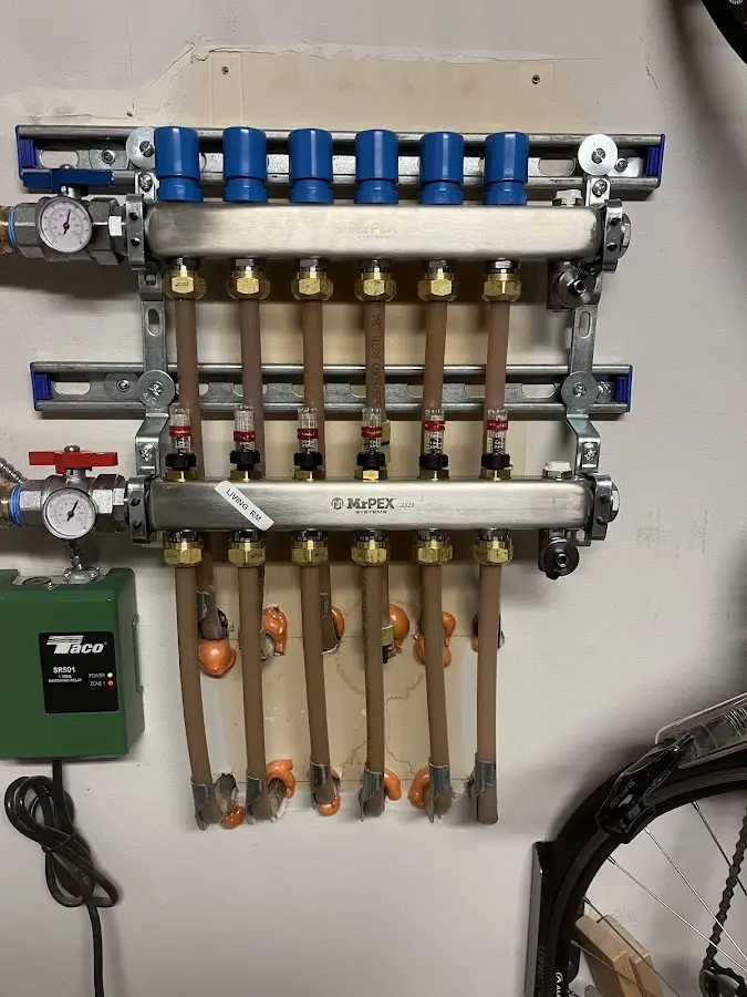 Plumber performing Water Heater Repair at a residential property in Aurora